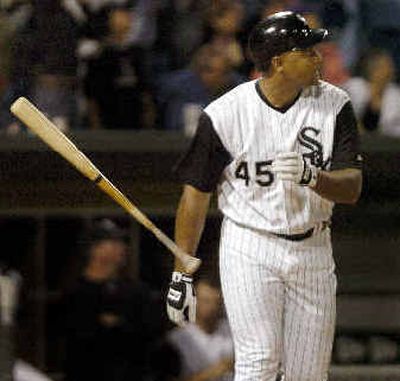
Carlos Lee watches his second home run of the game fly, fly away in the seventh inning. 
 (Associated Press / The Spokesman-Review)