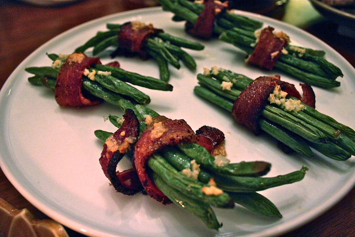 Skip the cream of mushroom soup this year and make green bean bundles with bacon and brown sugar for Thanksgiving dinner.