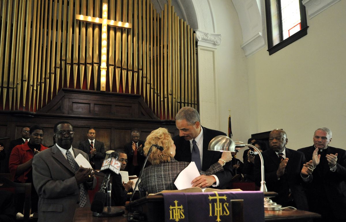 Attorney General Eric Holder hugs Peggy Wallace Kennedy, daughter of former Alabama Gov. George C. Wallace, after she introduced him to the congregation at the Brown Chapel AME Church in Selma, Ala., on Sunday,  the 44th anniversary of a violent 1965 voting rights march. Associated Press photos (Associated Press photos / The Spokesman-Review)