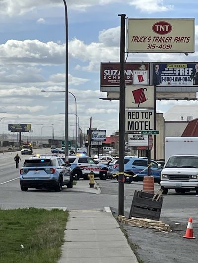 Authorities investigate a shooting at the Red Top Motel in Spokane Valley in March 2022.  (Garrett Cabeza / The Spokesman-Review)