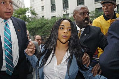 
Lil' Kim, whose real name is Kimberly Jones, exits Manhattan federal court following her sentencing in July  for lying to a grand jury in connection with a shootout outside a Manhattan radio station in 2001. 
 (Associated Press / The Spokesman-Review)