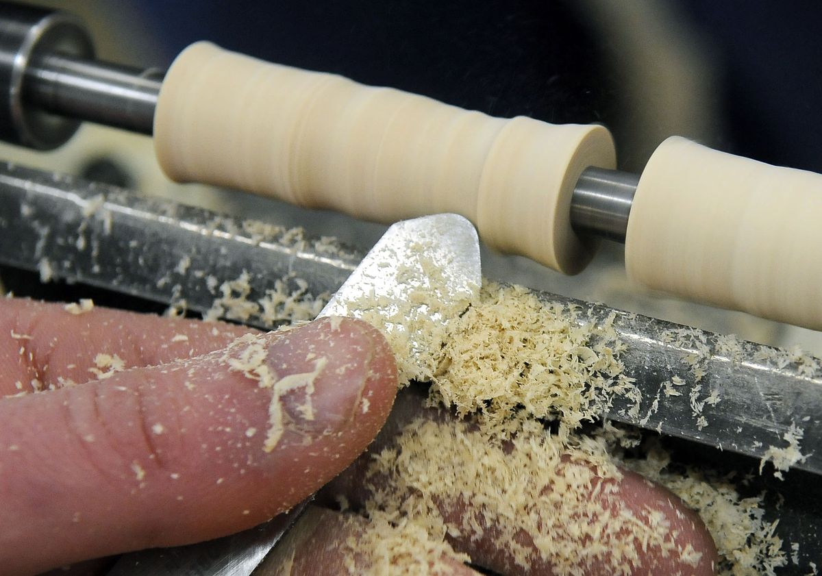 Quintyn Boomer’s wood pen takes shape on a mini lathe Saturday at Woodcraft in Spokane Valley. (Dan Pelle / The Spokesman-Review)