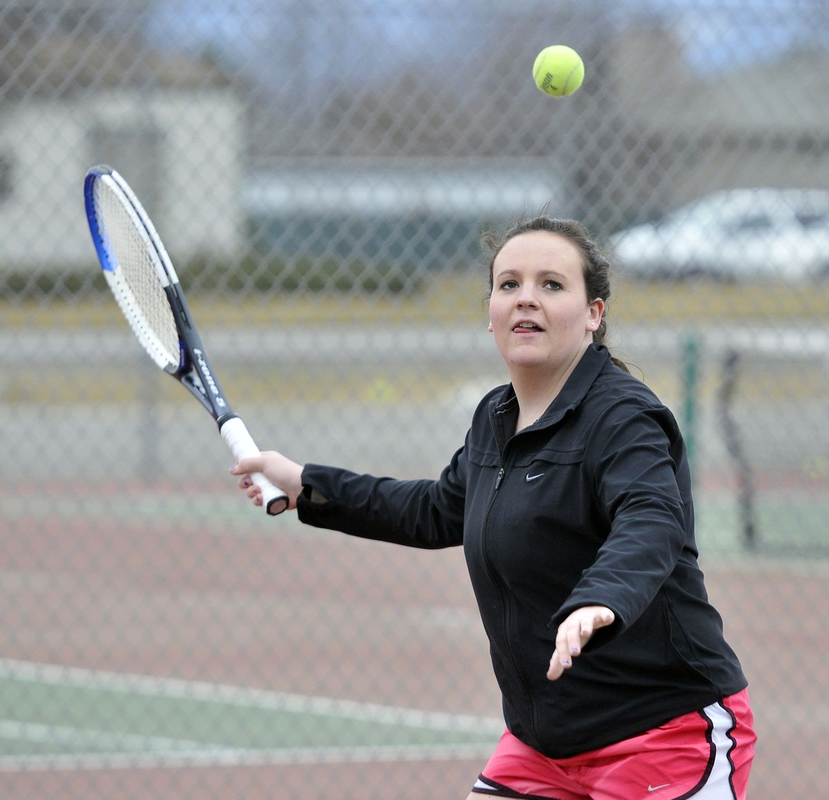 Callie Hanson, a senior at East Valley High School, practices Wednesday at the school for the spring tennis season. (Jesse Tinsley)
