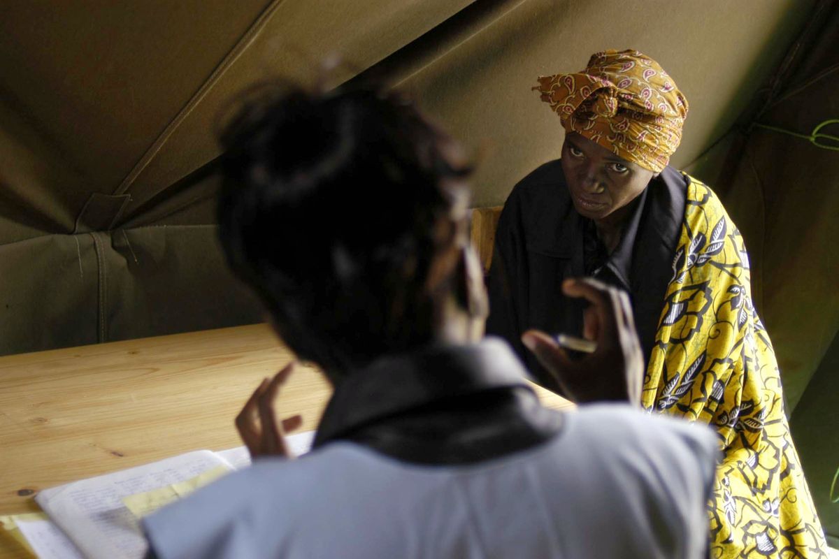 FILE -- A nurse counsels a patient applying to join a free HIV treatment program funded by the President