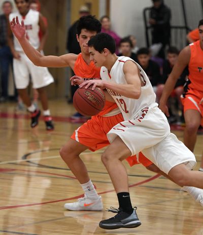 Shamrock Campbell  of Ferris dribbles during the first half of a Greater Spokane League boys basketball game, Dec. 15, 2016, at Ferris High School. (Colin Mulvany / The Spokesman-Review)