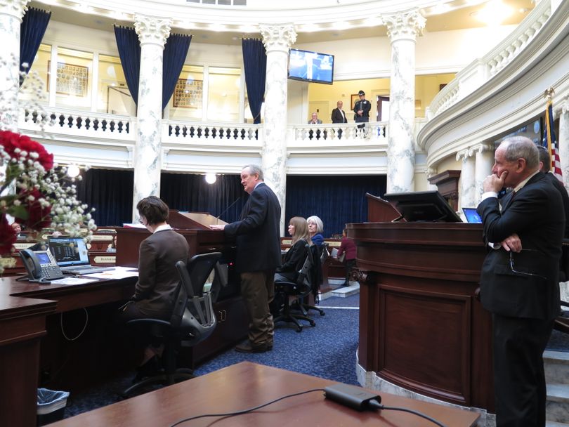 U.S. Sen. Mike Crapo, center, addresses the Idaho House on Wednesday, Feb. 21, 2018, as U.S. Sen. Jim Risch, right, awaits his turn to speak. (Betsy Z. Russell)