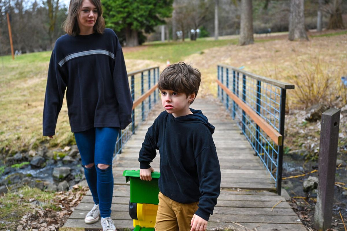 Dory Liddicoat and her son, Jaxson Hirschi, 5, visit a favorite spot in the Finch Arboretum on Thursday in Spokane. Jaxson was diagnosed with autism spectrum disorder in February 2021 when he was 3 years old.  (DAN PELLE/THE SPOKESMAN-REVIEW)