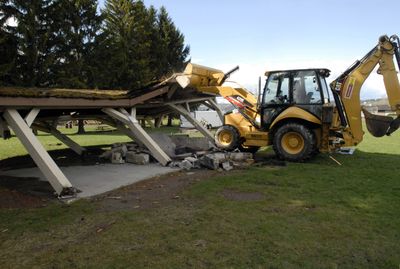 Steve Spady of Skyline Construction knocks down the picnic shelter at Valley Mission Park on April 13. “I wish they took this long to build,” he commented about the quick, 20-second demolition. The park is getting a new 2,400-square-foot shelter as part of a $156,173 project that includes new playground equipment, landscaping and lighting. The improvements are scheduled to completed by the end of May.  (J. BART RAYNIAK / The Spokesman-Review)