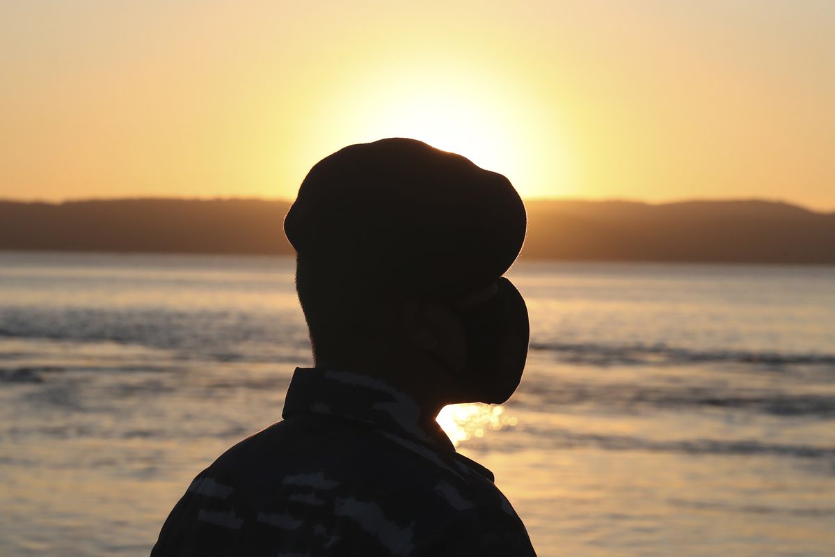 A member of Indonesian navy stands guard at Tanjung Wangi port in Banyuwangi, East Java, Indonesia, Saturday, April 24, 2021. Indonesia