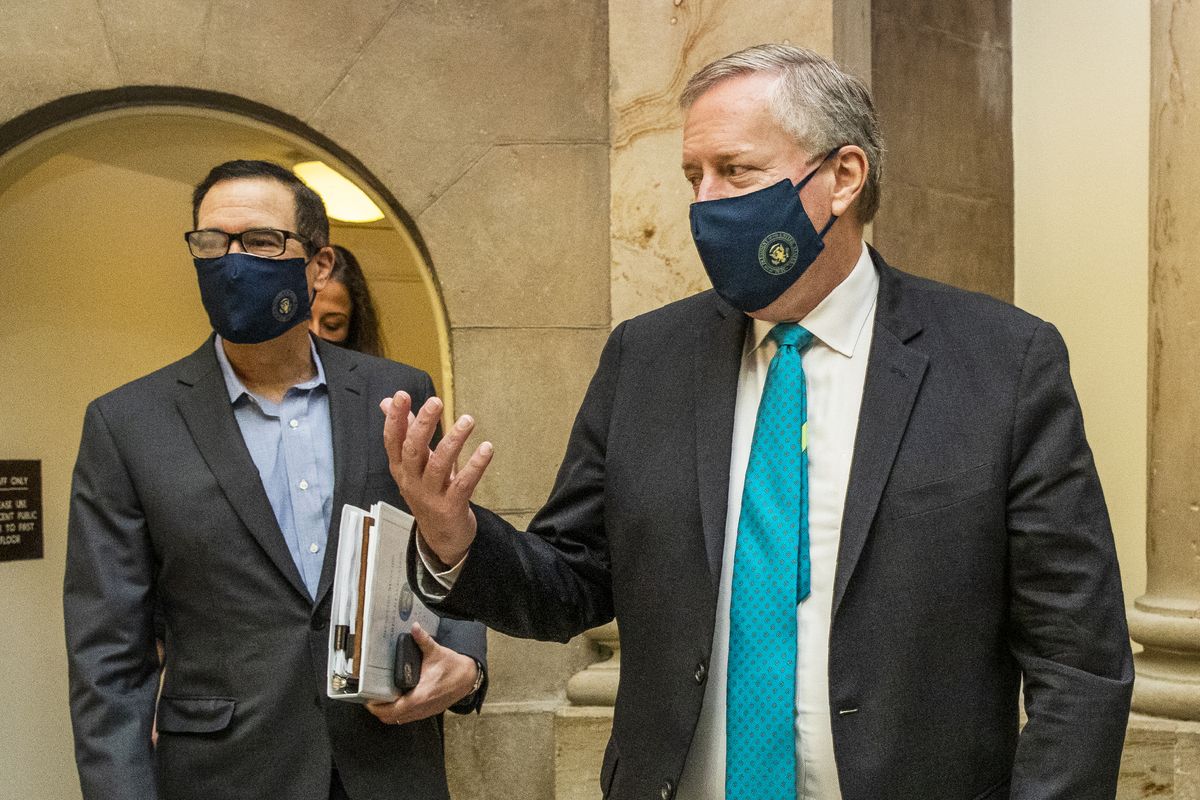 White House chief of staff Mark Meadows, right, and Treasury Secretary Steven Mnuchin, arrive at the office of House Speaker Nancy Pelosi at the Capitol to resume talks on a COVID-19 relief bill, Saturday, Aug. 1, 2020, in Washington. (Manuel Balce Ceneta)