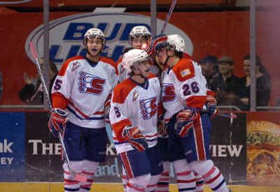 
The Chiefs congratulate Seth Compton, right, after his goal. 
 (Jesse Tinsley / The Spokesman-Review)