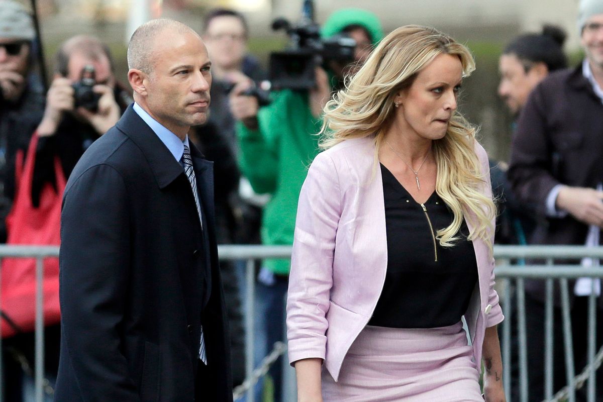 CORRECTS YEAR OF SENTENCING TO 2022, NOT 2020 - FILE - Stormy Daniels and her attorney Michael Avenatti leave federal court in New York, on April 16, 2018. Avenatti was sentenced Thursday, June, 2, 2022, to four years in prison for cheating client Stormy Daniels, the porn actor who catapulted him to fame, of hundreds of thousands of dollars in book proceeds.  (Seth Wenig)