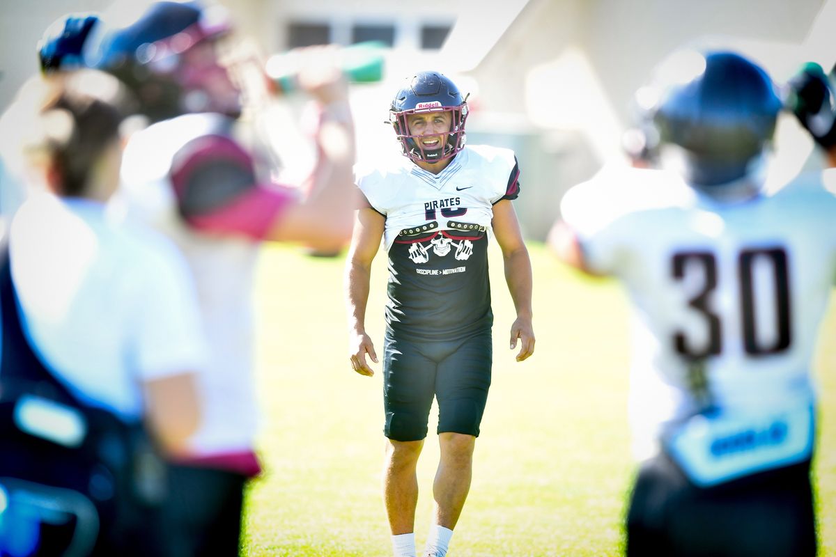 Whitworth’s BJ Mullin (16) chats with teammates during a college football practice on Tuesday, Aug. 16, 2022, at Whitworth in Spokane, Wash.  (Tyler Tjomsland/The Spokesman-Review)