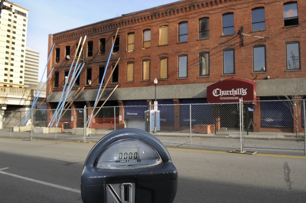 Part of Post Street in Spokane has been blocked since the Joel Building was damaged by fire in July. The Dorian Studios part of the building will be torn down.  (Dan Pelle / The Spokesman-Review)