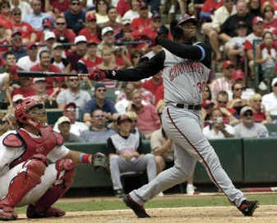 
Cincinnati outfielder Ken Griffey Jr. and St. Louis catcher Mike Matheny watch the flight of Junior's career home run No. 500, a solo shot in the sixth inning on Sunday in St. Louis. 
 (Associated Press / The Spokesman-Review)