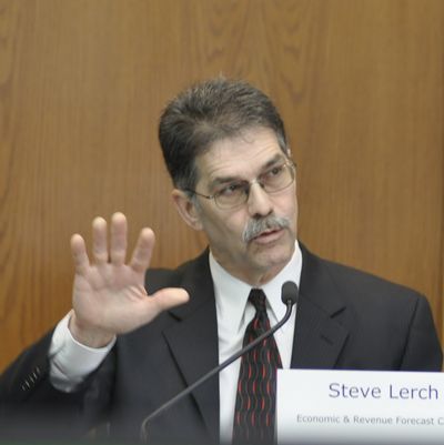 OLYMPIA -- State economist Steve Lerch explains factors in the Washington economy that lead forecasters to slightly increase the amount they think will be available for the budget through June 2019 during a meeting of the Economic and Revenue Forecast Council Thursday. (Jim Camden/The Spokesman-Review)