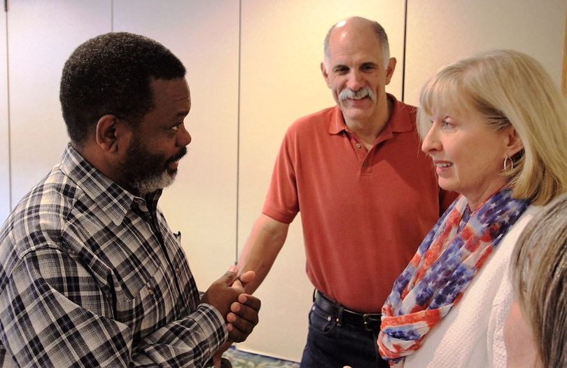 Alex Barron, left, secretary of the Kootenai County Republican Central Committee and the self-described Bard of the American Redoubt, speaks with state Sen. Mary Souza, R-Coeur d'Alene, while local GOP Chairman Brent Regan looks on. (Duane Rasmussen file photo)