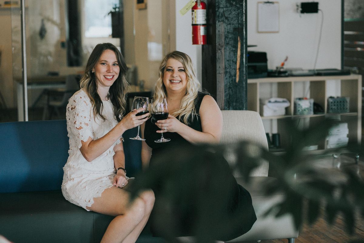 Sarah Carleton (left) and Erin Peterson pose with glasses of wine. The pair founded the Spokane Culinary Arts Guild and are preparing for their first-time restaurant awards, slated to be given out at the first of the year. (Courtesy photo)