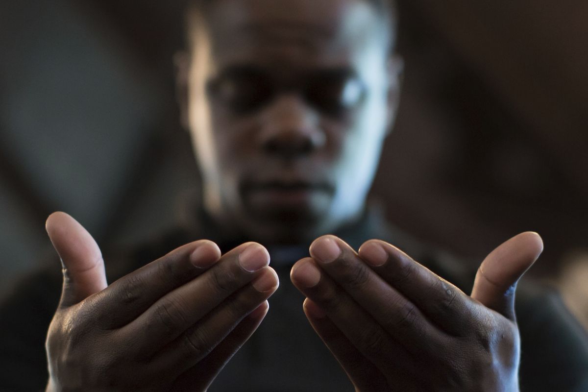 In this Monday, July 11, 2016 photo, Paul Bronson prays during a Black Lives Matter prayer vigil at First Baptist Church, a predominantly African-American congregation, in Macon, Ga. According to a Pew study released on Tuesday, Feb. 16, 2021, Black Americans attend church more regularly than Americans overall, and pray more often. Most of them attend churches that are predominantly Black -- yet many would like those congregations to become racially diverse.  (Branden Camp)