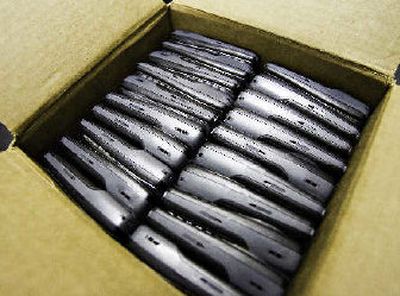 
Cellular phones sit boxed and ready for resale.
 (Associated Press / The Spokesman-Review)