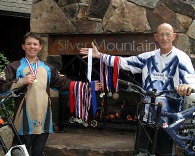 
Cody Dumont and Roger Baker display medals from mountain bike downhill racing over the summer.
 (Barbara Minton / The Spokesman-Review)