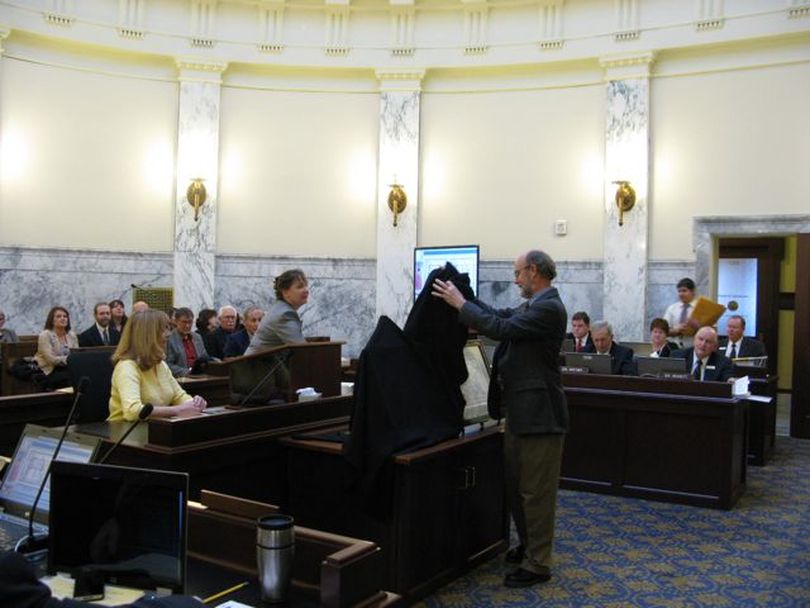 State historian Keith Petersen unveils historic maps of Idaho Territory to the Joint Finance-Appropriations Committee on Thursday. (Betsy Russell)