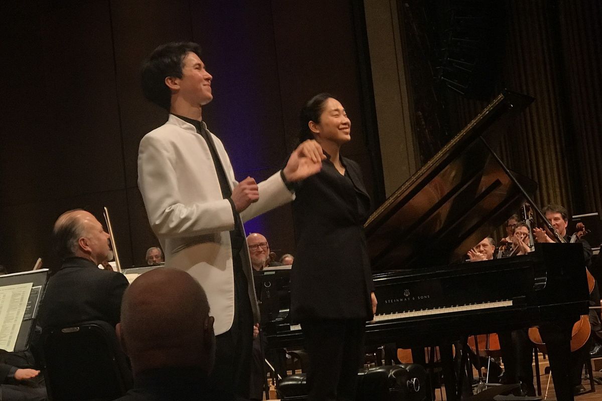 Pianist Charlie Albright and guest conductor Holly Hyundai Choe respond to a standing ovation after the Spokane Symphony played Sergei Rachmaninoff’s Piano Concerto No. 2 on Saturday, Jan. 20, 2024, at the Fox Theater in Spokane.  (Jonathan Brunt/The Spokesman-Review)