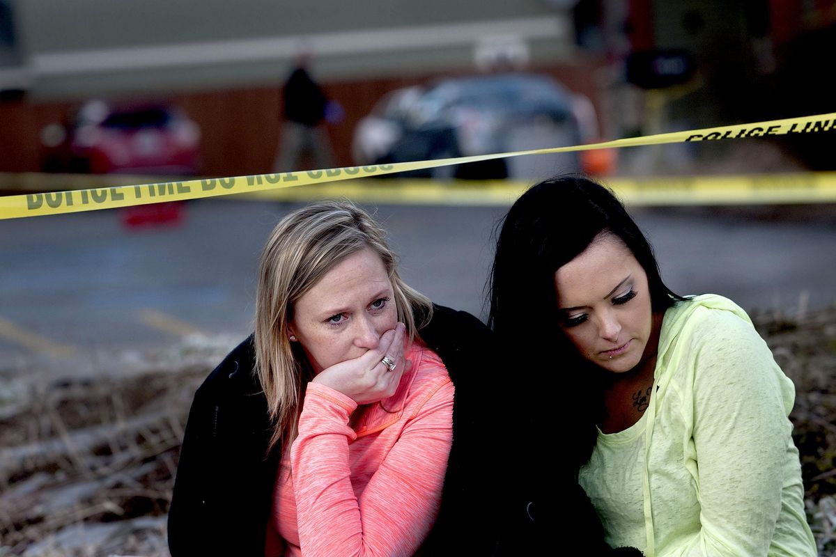 “He saved me,” said Amanda Padula, left, as she and Deborah Young sat outside Altar Church in Coeur d’Alene, where pastor Tim Remington was shot six times as he was leaving services on Sunday, March 6, 2016. The women benefited from Remington’s Good Samaritan Rehabilitation program. (Kathy Plonka / The Spokesman-Review)