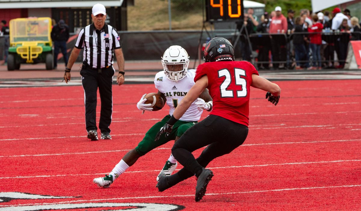 J’uan Campbell  of Cal Poly tries to change directions before getting tackled by Eastern Washington’s Calin Criner (25)  during a Sept. 22 game at Roos Field in Cheney. (Libby Kamrowski / The Spokesman-Review)