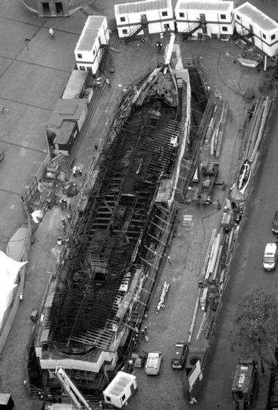 
 The charred 19th century clipper  Cutty Sark is seen after a fire at the ship's dry dock  Monday. 
 (Associated Press / The Spokesman-Review)