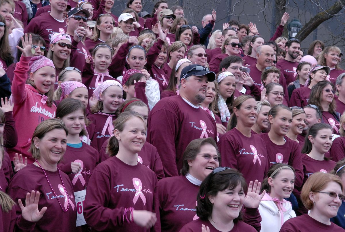 More than  350 people from Team Lisa pose for a photo before Sunday’s  Race for the Cure in Spokane. The team formed in honor of Lisa Stiles Gyllenhammer, a Shilo Hills Elementary School teacher who died of breast cancer three years ago. “She was a mother, a daughter and a wife … an incredible woman,”  friend Susan Schlosser said.  (Photos by J. BART RAYNIAK / The Spokesman-Review)