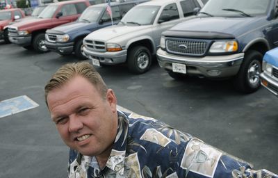 Jon Burke of 3 Fat Guys on east Sprague in Spokane Valley has many SUVs and trucks waiting for sale on his lot.  (Dan Pelle / The Spokesman-Review)