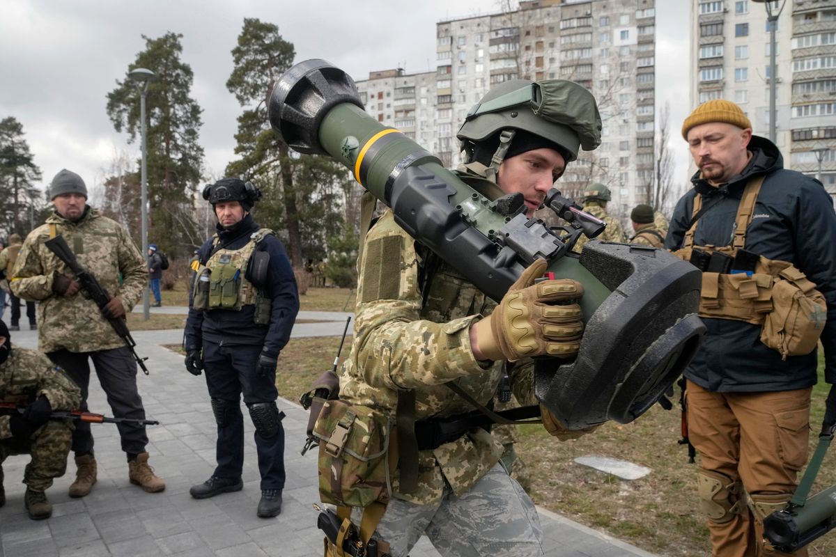 A Ukrainian Territorial Defence Forces member holds an NLAW anti-tank weapon in the outskirts of Kyiv, Ukraine, on March 9.  (Efrem Lukatsky)