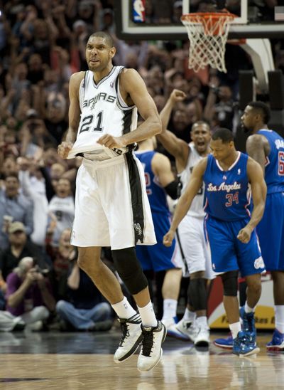 Tim Duncan celebrates after his game-winning three-point play. (Associated Press)