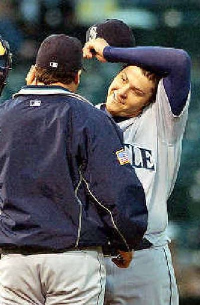 
M's manager Bob Melvin sends starter Travis Blackley to the showers. 
 (Associated Press / The Spokesman-Review)