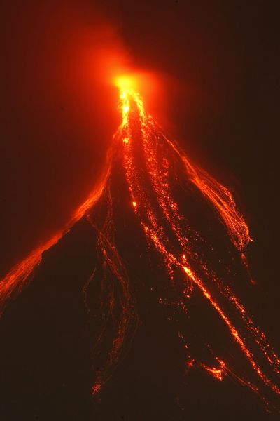 Lava cascades down Mayon volcano in Albay province,  Philippines, on Sunday evening.  (Associated Press)