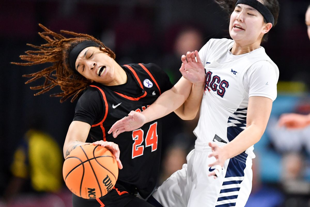 Pacific Tigers guard Liz Smith (24) collides with Gonzaga Bulldogs guard Kayleigh Truong (11) drawing a foul during the first half of a WCC women’s semifinal basketball game on Monday, March 11, 2024, at the Orleans Arena in Las Vegas, Nev.  (Tyler Tjomsland/The Spokesman-Review)