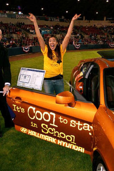 
Nikiko Johnson of Mt. Spokane High School celebrates after winning a car June 19 at Avista Stadium in a drawing of  students who has perfect attendance their senior year.
 (Courtesy of Sean Lumsden / The Spokesman-Review)