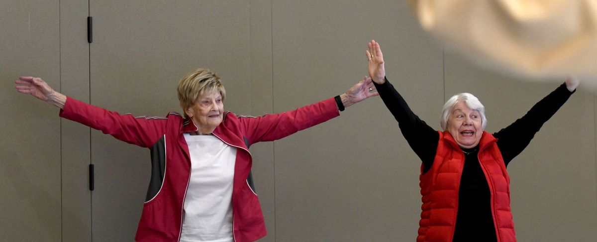 Donna Grumm, left and Bernie Moore participate in a demonstration of exercises Tuesday during the A Matter of Balance class at Rockwood Retirement South Hill.  (Kathy Plonka/The Spokesman-Review)