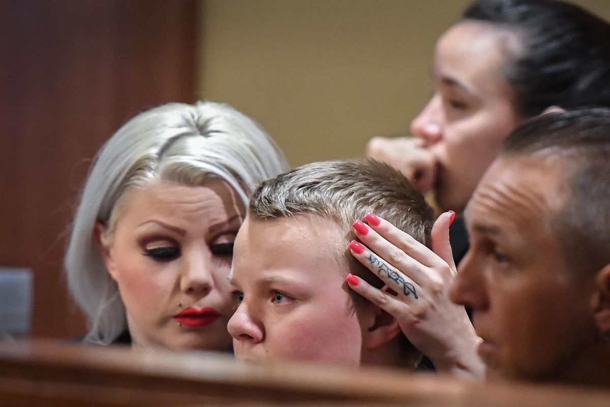 Sapphire Mattson, left, comforts her son, Quintin Varni, center, after the pair spoke to Judge Kevin Korsmo, Friday, May 25, 2018, concerning the attack on Mattson by Sonny Cannella. Quintin called 911 after the beating and probably saved his mother’s life, said Korsmo. Cannella plead guilty to assault in the first degree. (Dan Pelle / The Spokesman-Review)