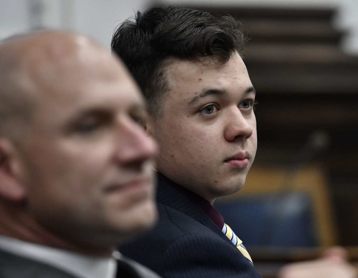 Kyle Rittenhouse, right, and his attorney Corey Chirafisi listen during his trial at the Kenosha County Courthouse in Kenosha, Wis., on Thursday, Nov. 11, 2021. Rittenhouse is accused of killing two people and wounding a third during a protest over police brutality in Kenosha, last year.  (SEAN KRAJACIC)