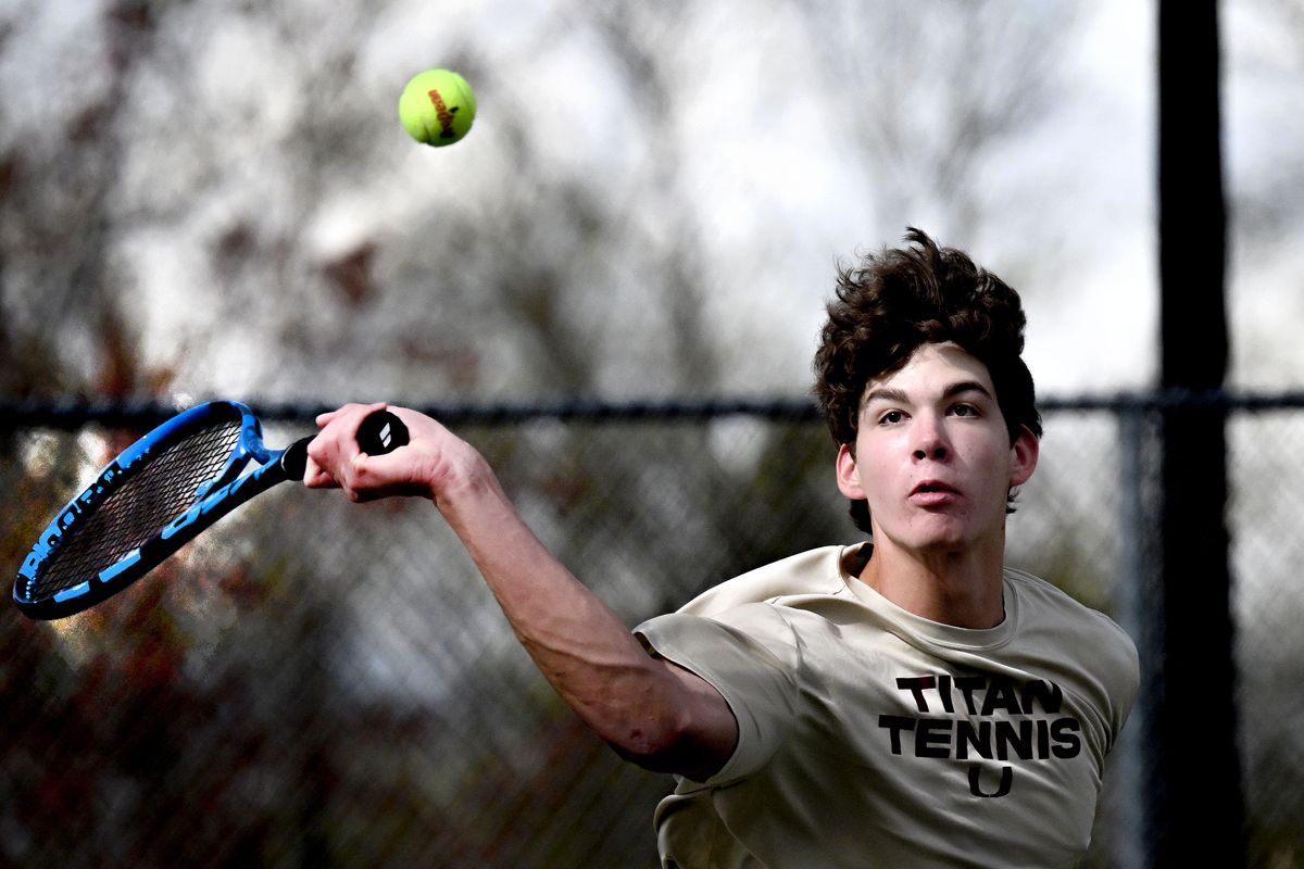 University High School multi-sport athlete Shane Skidmore eyes a return during a match at the school in Spokane Valley on Tuesday, April 30, 2024.  (Kathy Plonka/The Spokesman-Review)