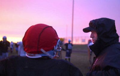 
Freeman High football head coach Jim Wood speaks with one of his players during an after-school practice Tuesday. 
 (Liz Kishimoto / The Spokesman-Review)