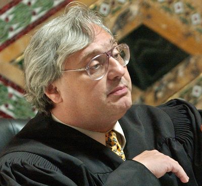 FILE - In this Sept. 22, 2003, file photo, Judge Alex Kozinski, of the 9th U.S. Circuit Court of Appeals, gestures in San Francisco. Krazinski announced his immediate retirement Monday, Dec. 18, 2017, days after women alleged he subjected them to inappropriate sexual conduct or comments. (Paul Sakuma / Associated Press)