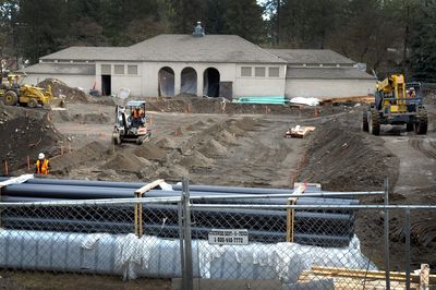 Comstock Pool renovation is hitting full stride with warmer weather. Construction crews were busy at the site Monday,  and the general shape of the new pool has become evident.  (Christopher Anderson / The Spokesman-Review)