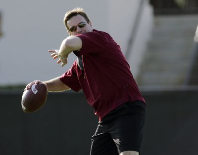 Oklahoma coach Bob Stoops plays catch with members of his team during practice on Friday.  (Associated Press / The Spokesman-Review)