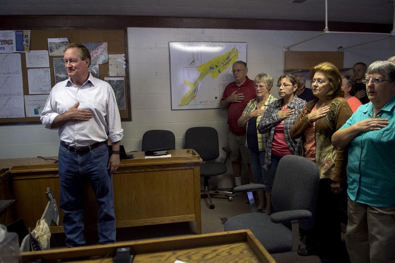 Idaho Senator Mike Crapo says The Pledge of Allegiance before holding a town hall meeting at Wardner City Hall on Thursday, September 1, 2016. (Kathy Plonka / The Spokesman-Review)