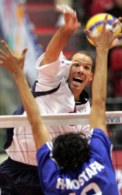 
U.S. outside hitter Reid Priddy spikes the ball during a November match against Egypt in Tokyo. 
 (Associated Press / The Spokesman-Review)
