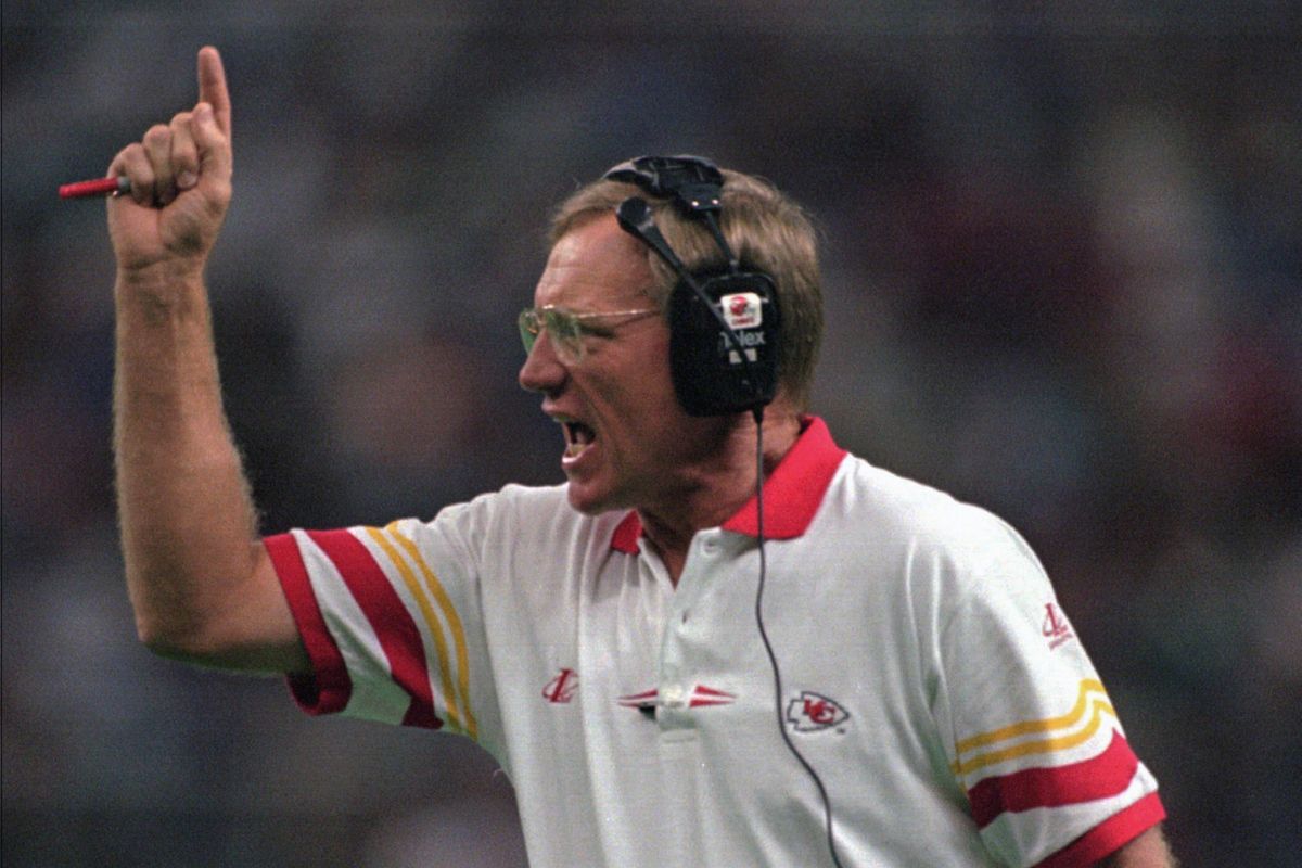 In this Sept. 15, 1996 photo, Kansas City Chiefs coach Marty Schottenheimer yells instructions to his team as they play against the Seattle Seahawks in Seattle. Marty Schottenheimer, who won 200 regular-season games with four NFL teams thanks to his “Martyball” brand of smash-mouth football but regularly fell short in the playoffs, has died. He was 77. Schottenheimer died Monday night, Feb. 8, 2021, at a hospice in Charlotte, North Carolina, his family said through Bob Moore, former Kansas City Chiefs publicist.  (BARRY SWEET)