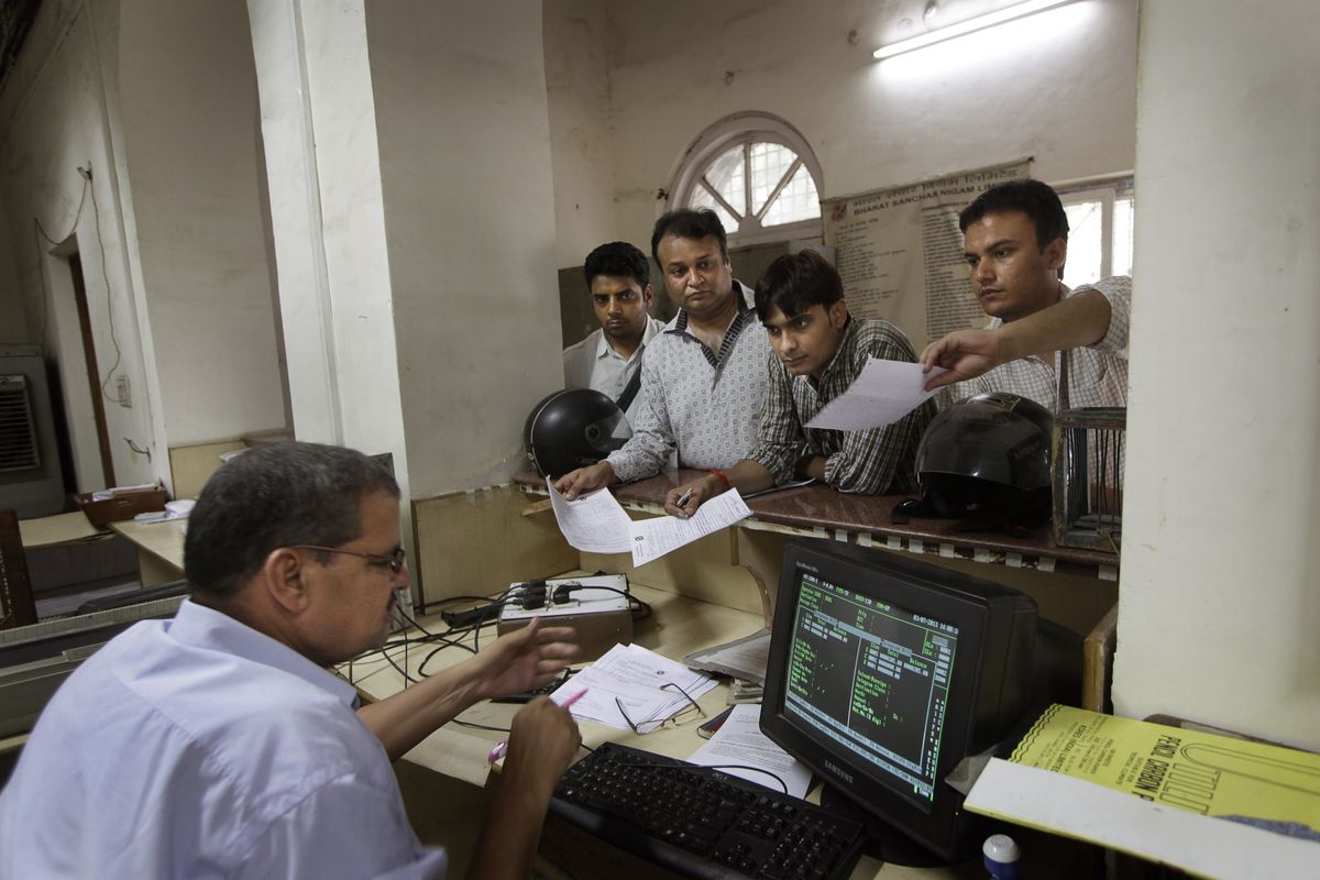 Telegraph officer Baljit Singh takes telegram messages from customers at the Kashmere Gate telegraph office in New Delhi. Singh, who became a telegraph operator in 1972, will retire in a few months. (Associated Press)